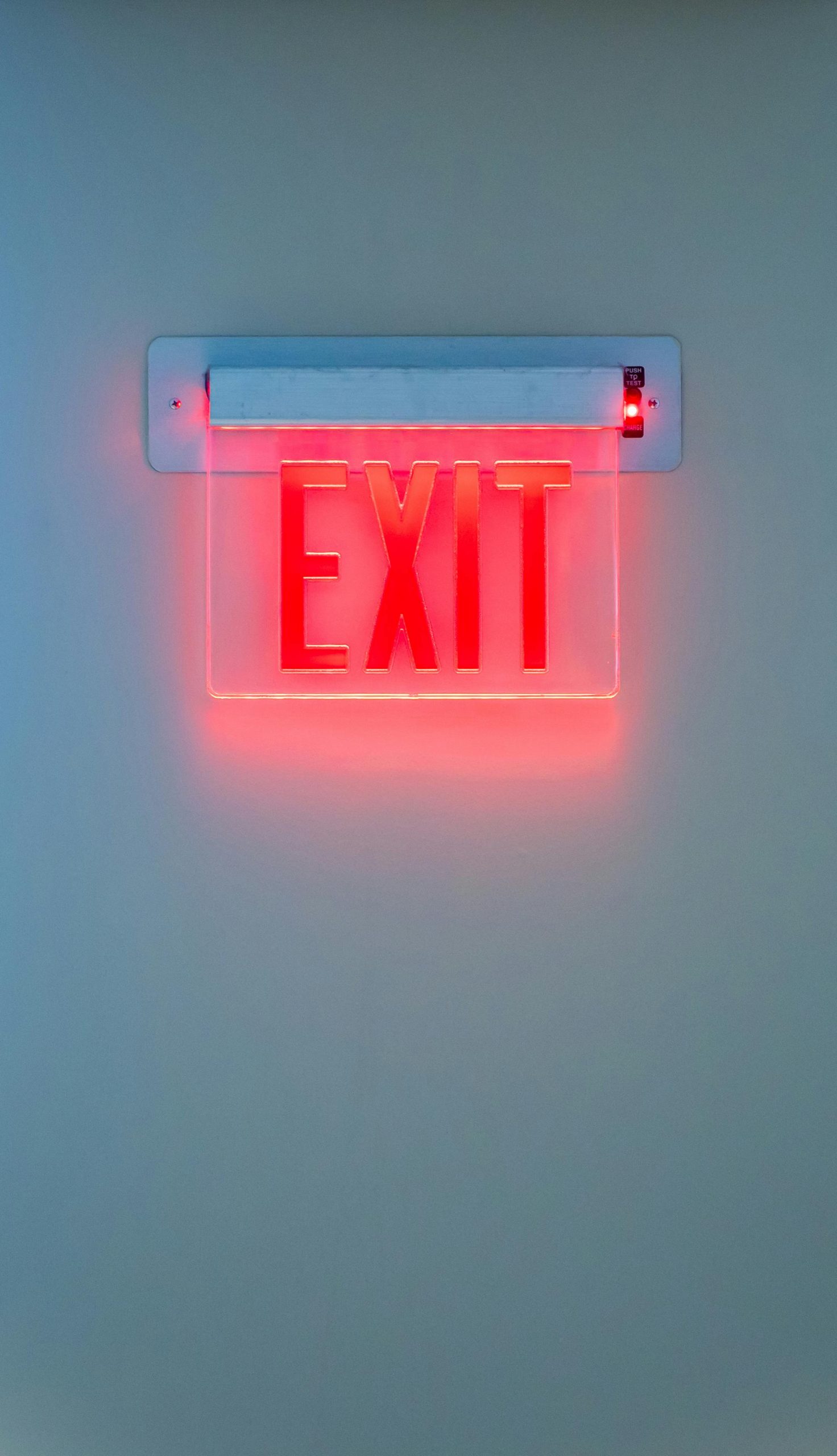 A red exit sign representing exit planning and the "silver tsunami" in the U.S